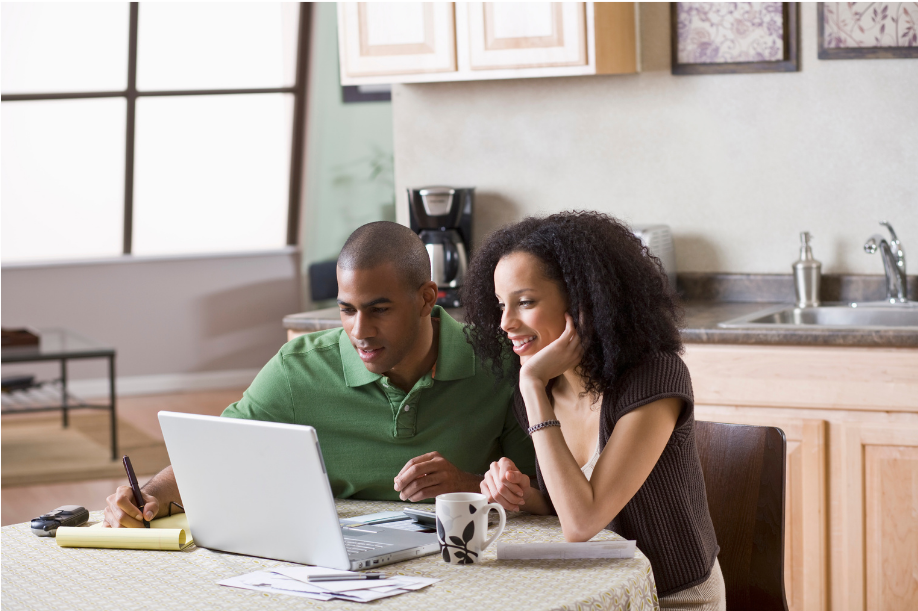 black-couple-looking-at-computer-