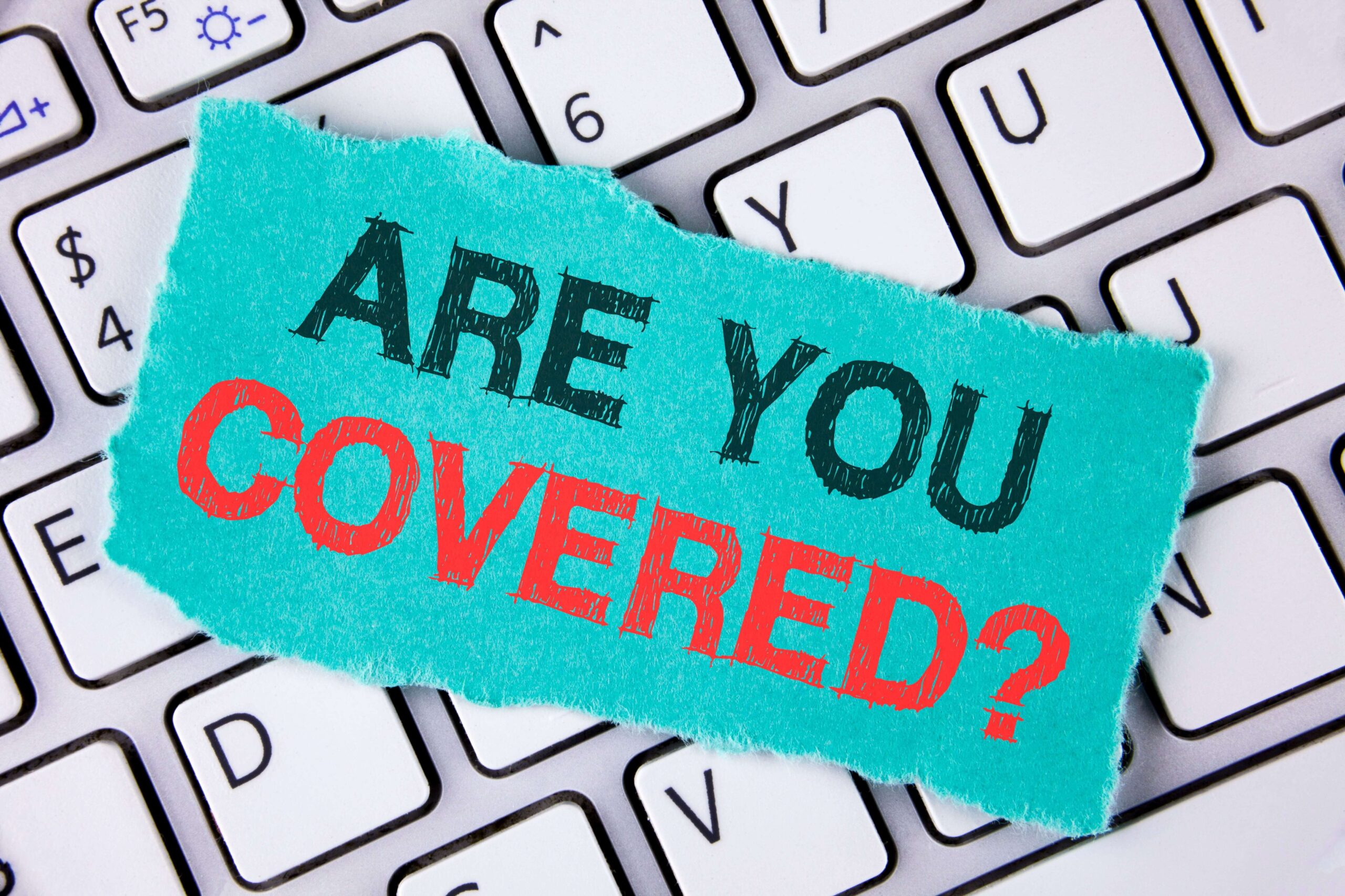 a label on a keyboard that reads "Are You Covered?"