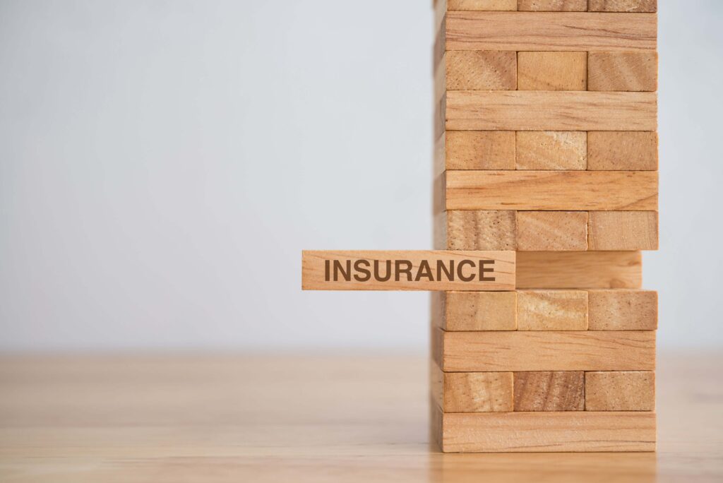Jenga blocks with insurance as one of them