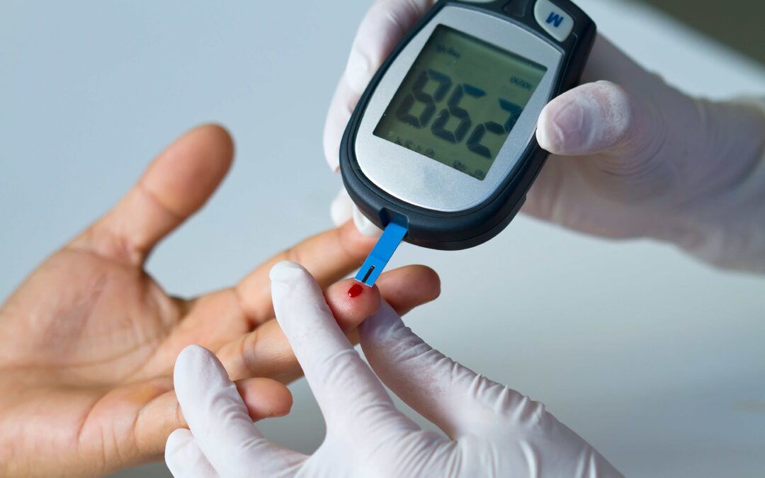 Person getting their blood sugar tested through their finger